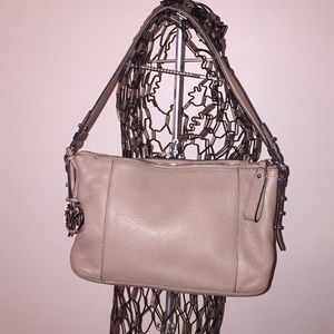 Beige leather handbag with stud details